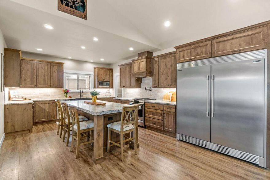 SELLER OFFERING $20K CREDIT TO BUYER FOR RATE BUY DOWN/CLOSING COSTS, ETC.  Stunning, single story home on 8.26 acres, minutes to the Old Mill District! This home had a large addition & beautiful remodel in 2018. Upon entry, you're immediately drawn to the large open living area w/ vaulted ceilings & floor to ceiling stone fireplace. The kitchen features a double fridge & freezer, Knotty Alder cabinets, farmhouse sink, Leathered Granite countertops, under cabinet lighting & walk in pantry. 3 of the bedrooms have walk in closets & attached bathrooms, plus a bonus room that could be a 5th bedroom. The largest of the primary suites features a double shower, tile floors, granite countertops, walk in closet & soaking tub. Outside you'll find a paver patio with propane bbq stub, large lawn area, chicken coop, two separate pastures with plenty of room for your horses or cows, 7.1 acres of irrigation, a large shop, hay cover, pond & canal. The property is fenced & gated with oil pipe fencing.