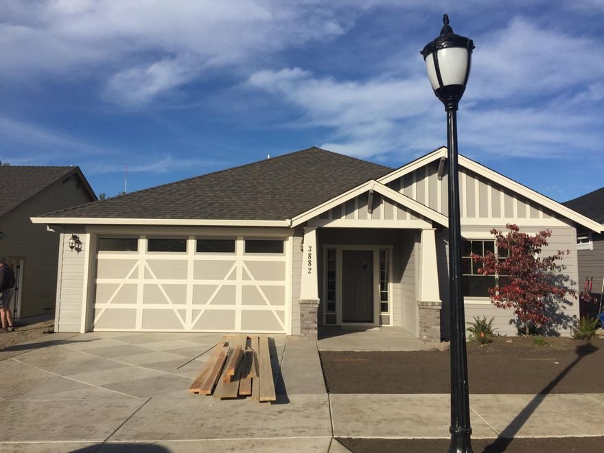 Built in 2016 in a beautiful country setting in the East Medford area with views of surrounding mountains nearby. An exceptional quality builder that we've grown to love in the valley throughout the years is what you get when you purchase a home built by Pacific Trend Building Company. A stunning craftsman style home with approximately 1,727 sq. ft., 3 bedrooms, 2 full baths, hardwood floors in entry, kitchen and nook area round out this home. An open kitchen with beautiful granite counters and island. Custom cabinets throughout are birch and alder with the highest quality in the industry. Carpet throughout bedrooms and living room along with a beautiful brick fireplace. Bathrooms include granite counters and tile flooring. Professional landscaping in front and back round out this home. Estimated completion date September 2016.