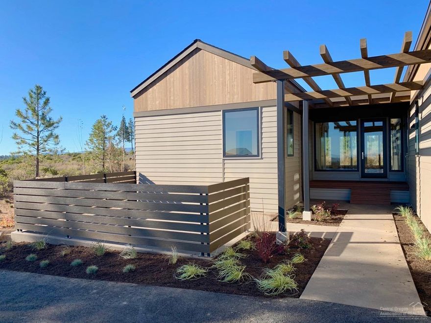 Contemporary design by BendTrend Homes in the Trailhead community of Tetherow. Luxury finishes and craftsmanship throughout include hardwoods, quartz counters, high-end JennAir appliances, fully tiled showers and floors in all bathrooms, stylish fixturing and Sonos system as standard. Direct access to Phil's Trail system for mountain biking and hiking just out your back door from this enclave of 28 homes across from the Tetherow pool, fitness center, dining, and golf course.