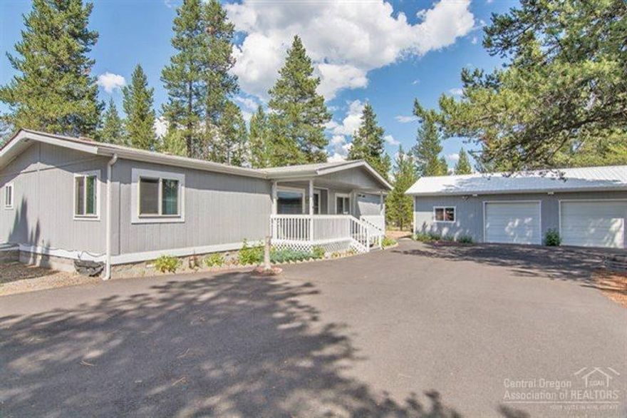 Cute 3 bedroom, 2 bath, 1620 sq ft single story home on 1 acre with a large 2 car garage/shop & paved circular driveway; all rooms are vaulted except for 2 guest bedrooms & baths; kitchen with birch cabinets & skylight; living room with large view window; oversized family room with ceiling fan; spacious master bedroom; large master bath with dual vanities, & extra storage cabinets; new furnace & dishwasher; dual pane windows throughout; covered front porch; rain gutters; extra storage building.