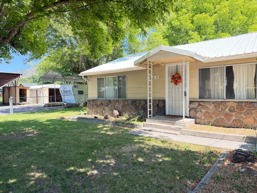 Clean and ready to go 2 bed 1 bath home with a large lot and extra covered parking/shop space. Laminate flooring throughout the home, with an updated jack and Jill bathroom. The kitchen has counter top space and this is a functional floor plan. The living room in spacious with vaulted ceilings providing the feeling of even more space. Back yard is partially fenced, only needing fencing on one side to seal it off. Ample parking and room for someone who either has multiple vehicles or other toys! Come take a look today before this home is gone!