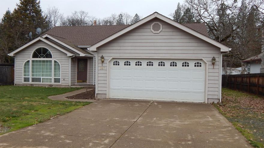 Lovely home built in 2003, shows pride of ownership and wonderful floor plan. Not your everyday typical home, this has some character. In the living room you'll find tall arched windows, dual sided gas fireplace and lots of plant shelves with some lighting for displaying all your treasures. The kitchen is open to the living room and there are two dining areas. The slider out to the back patio offers easy access from the kitchen to your summer bar-b-ques. There are a lot of built-in storage cabinets throughout the home. The master offers glass slider to backyard, double sinks and oversized shower with more built-ins for linens and such. You will truly appreciate living here with the close proximity to the famous Rogue River for fishing and floating and tons of year around recreation and all the arts one would desire.