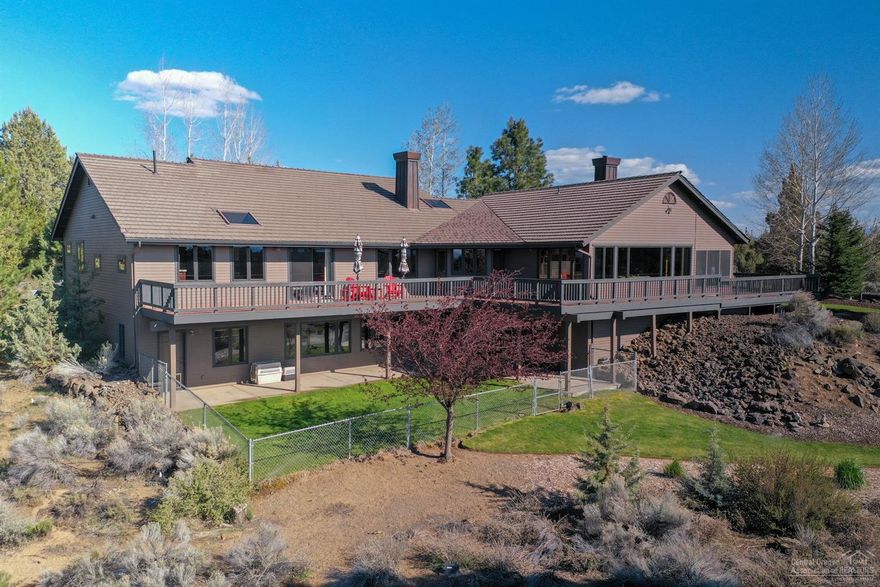 Perched above a natural landscape with spectacular Cascade mountain views on 4.96 acres, this Northwest design offers an expansive floor plan and casual luxury living. Completely remodeled with the best quality finishes including solid oak hardwood & travertine stone floors, granite countertops, knotty alder & quilted maple cabinets, high end bath fixtures, vaulted ceilings, art niches and a wood burning fireplace, The main level master suite boasts an extraordinary master bath including a custom walk-thru closet and dressing room with extensive built-in cabinetry. The lower level provides a gathering room, 2 bedrooms & bath, a second kitchen, wine storage, additional laundry room and separate entrance for guest use or ease of access. Plus, lots of exterior decking that's perfect for relaxing & enjoying all those Bluebird days with the white mountain peaks in your backyard!