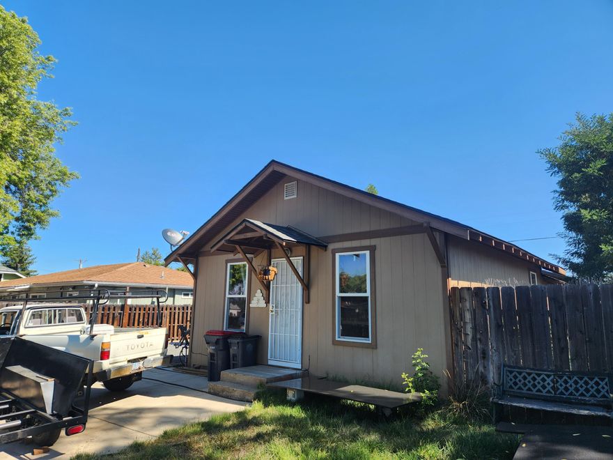 Two home on one property! Great potential investment opportunity. Live in one and rent out the other. Or a multi family setup. Lots of options! The front unit was built in 1927 and has been updated throughout.  It's a one bedroom, one full bath with a small bonus room that could be used as another bedroom without a closet. Nice size living area and kitchen with laundry room. Private, fenced backyard. Back unit  was added to the property in 2010 and is a three bedroom, two full baths with an open living and kitchen area. Detached garage with driveway and additional parking behind the garage. Private, fenced front and side yards. Great rental history with awesome tenants who wish to stay.