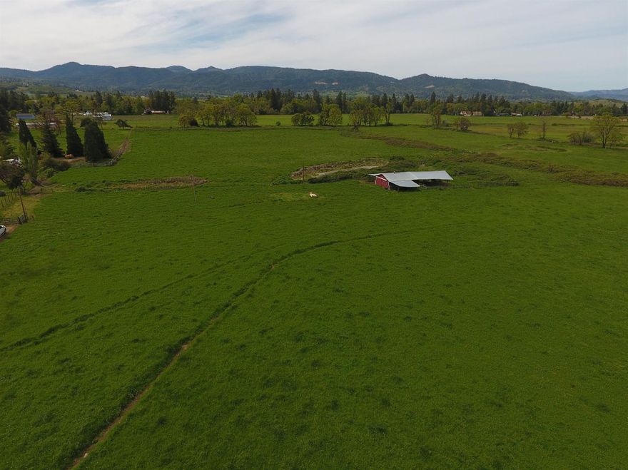 21 acres zoned EFU with 20.9 acres of water rights with Medford Irrigation District. Good flat usable ground with Coleman Loam, Medford Silty Clay and Ruch Silt Loam soils. Property is located off Oak Grove Road in Medford on the west side between Main St. and Madrona Lane. The property is currently being used for hay production. There is a couple of ponds and an older barn on the property. Buyers to do their own due diligence regarding use and building requirements.