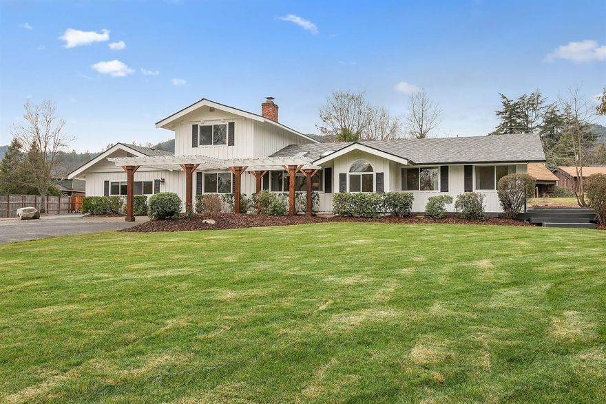 Location! Location! Location! This great house built in 1973 has been updated with new roof, new windows, fresh paint inside and out, new light fixtures, new water heaters, beautiful new laminate flooring, tile and new carpeting. Great floor plan with living room, vaulted ceilings and gas fireplace. Formal dining room, breakfast nook and an amazing kitchen with new quartz countertops, island, new Viking 6 burner gas range and pot filler, wine fridge, dishwasher and plenty of beautiful cabinetry for all your kitchen needs. The main level master suite features new tiled walk in shower and dbl sink vanity. Another bedroom, office and nice sized laundry room with sink on the main level. Finished basement would make a great media/family room. Upstairs is a full bathroom and two other bedrooms. There is a 2 car attached garage and workshop area. Plus there is a barn, storage shed and all on approx. 2 acres and irrigation! Great house in a great location!