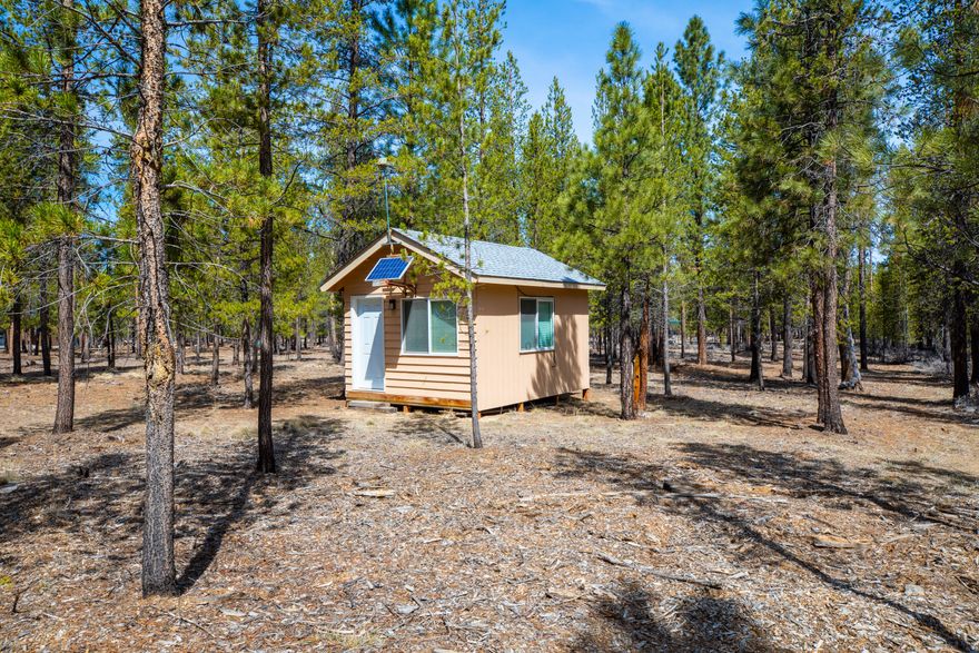 This great 1.39 acre parcel has easy access off a paved road making it easy to enjoy your Central Oregon getaway. Includes a cute 12x16 Wood Cabin with a solar panel ready for overnight stay and memory making. Parcel has been cleared of the underbrush and the east boundary adjoins to forest service land. Plus, a 12x12 RV cover. Septic percolation test is on file with the county. Sun Forest Estates has a road maintenance which includes snow plowing in the winter. Central Oregon offers numerous lakes and outdoor activities, fishing, camping, hiking, hunting, ATV, stargazing and relaxing. Come on out and take a look now!