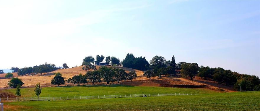 Located in the prestigious King's Landing gated community in Southwest Medford in the Pioneer Hills you will find this beautiful 5 acre parcel ready to build your custom home. As you enter through the Gorgeous Wrought Iron Gates you will travel on the Asphalt driveway as it curves up the hill. When you reach the property you will see the irrigated green lush meadow lined with beautiful Oak trees on one side and 3 rail white vinyl fencing on the other. The freshly cut driveway is rocked and the extra large home site is perched on the top of the knoll looking South over the meadow with amazing views. The under ground electric and well are installed. Standard septic and homesite approval is ready to go after you submit your drawings. You will not find a more stunning homesite property or location ready to build on. Call for your private showing as this property can not be seen from Pioneer road and must have gate code.