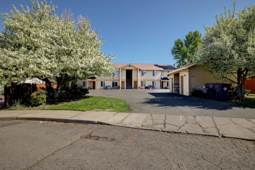 Income Property For Sale in Northeast Bend, Oregon.  Close to Saint Charles Medical Center. Unit 1 and 6 are two story units on each end. The 4 inside units are one level each.  Parking lot for tenants, laundry room with coin operated machines, and storage room with closets for tenants' belongings.