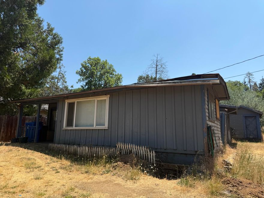 Investor Special! This 2 bedroom 1 bathroom home offers 967 square feet of potential on a fully fenced .34 acre lot. Whether you're an experienced investor or a buyer looking for a project, this fixer upper is full of opportunity. The generous lot provides room to expand, build an ADU, or create your dream outdoor space. Located 5 minutes from Rogue River access, shopping and entertainment. This property is ready for your vision so bring your tool belt this is the project you've been waiting for!