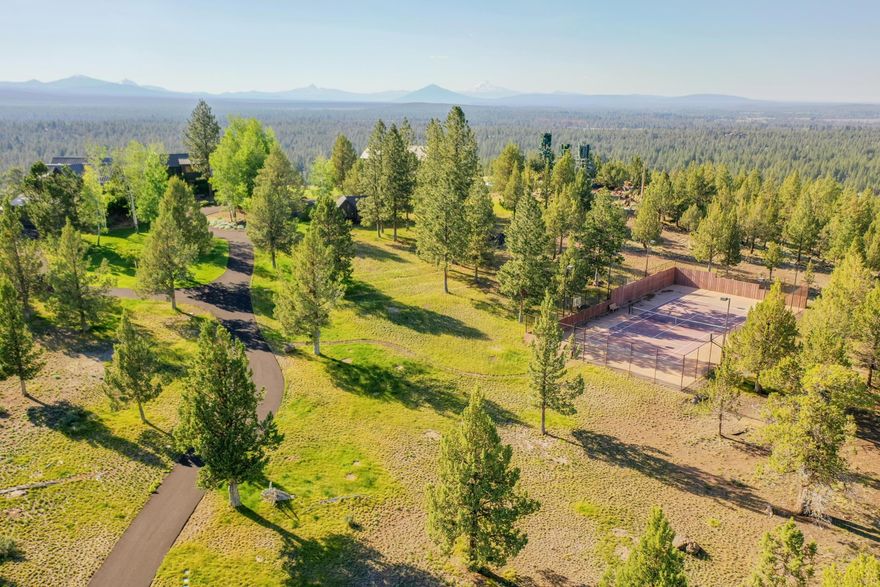 The historic site of the former Tumalo Butte Lookout is now offered for sale! Enjoy expansive views of the Cascade Mountain Range & the forest floor below. The home and lookout tower were designed by AOME Architects, known for their personalized approach to architecture, especially their commitment to blending historical & contemporary components. The 5,921-sf main house boasts clear fir, mesquite flooring & custom stone archways throughout. There are 4 ensuite bedrooms in the main house. The upstairs master suite encompasses the treetop views of the vast mountain range. There are 3 additional ensuite bedrooms, plus a spa, library & great room with gas fireplace. The lookout space - with two bedrooms, living room & office, plus an oversized attached high bay garages - offers the perfect combination of spaces. A detached RV/shop, tennis court, large patios & balconies offer endless options for entertaining. The home is offered mostly furnished. Call today for a private showing!