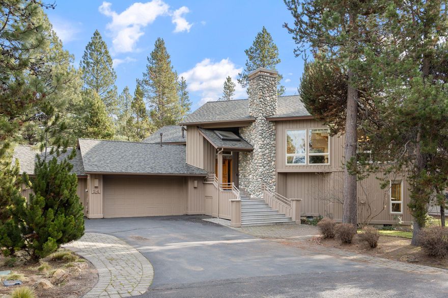 24 Bunker is positioned on an absolutely beautiful street on the North end of Sunriver! Backing directly to the trail system, this home blends instant adventure with serenity. A rare find, it has been a cherished private sanctuary, never rented, and remains in immaculate condition. Inside, rich wood accents and soaring windows create a bright, lodge-inspired atmosphere. The versatile layout features two en-suite bedrooms and a massive living room with fire place, easily serving as a 4th bedroom or game room/ bonus space. A heated 3-car garage offers supreme year-round storage for all your Central Oregon gear. Enjoy total peace of mind with significant recent capital improvements: New Roof, A/C, and Furnace (2024), Water Heater (2023), and fresh Exterior Paint (2022). Outdoor living shines on the generous deck with an awning and private hot tub (2022). This is the perfect blend of comfort, privacy, and turn-key luxury ready for immediate enjoyment. This is a must see property!