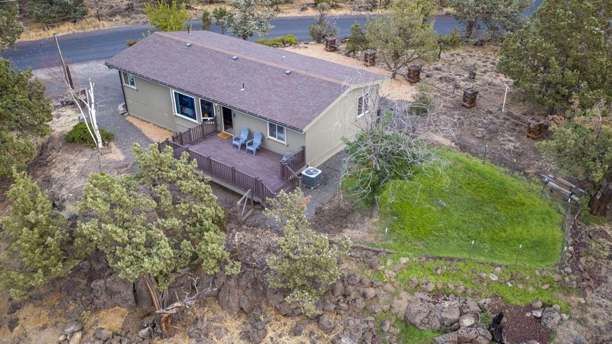 Perched proudly on a rocky rise in Rimrock West Estates, this fully renovated manufactured home makes the most of its 2.14 acres and its mountain views. Fresh paint inside and out sets the tone, while vaulted ceilings and a heat pump with electric forced air keep things airy and comfortable. The bathrooms shine with designer updates and modern fixtures, and the spacious primary suite offers the perfect retreat after a long day. Step out onto the large deck to catch the sunset or into the detached garage complete with RV-height roll-up door, sub-panel, and drywall—for all your toys, tools, and tall vehicles. There's room here for RVs, boats, and dreams of wide-open living. Property has short term rental permit, transferable. Move-in ready, a great value in a close-in location.