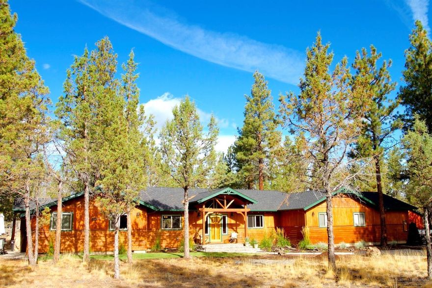 Stunning home with high end finishes, located on private 2.5 acres. Everything in this home is beautiful, from bamboo floors & granite counter tops, to warm wood ceilings. As you enter, you are greeted with a floor-to-ceiling stone see-through fireplace. Newly built shop & paved driveway. Woodworker's/hobbyist dream shop has office & separate half bath. Relax outside with your covered patio area just off the kitchen. Back deck has been expanded & now includes hot tub. This breathtaking home is a must see!