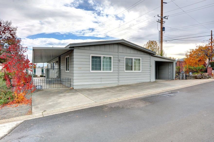 This well-taken care of 1,728 sf triple-wide home is close to the Bear Creek Greenway,
U.S Cellular Fields, and Edenvale Winery. Boasting a large living room, dining area, gas
fireplace, and a huge family room off the kitchen with bar seating! The primary suite has a soaking tub with double closets. ADA ready throughout with ramps and handrails, and also security screen doors with deadbolts front and back. 350 additional square feet of enclosed storage for shelving plus a workshop! Meticulous landscaping all around, stone work, brick retaining walls, garden with raised beds, sprinkler system, and a 60-foot covered patio. New carpet and pads, new flooring, new toilets, and vinyl
windows were updated. New water heater, new exterior paint, HVAC serviced regularly,
mostly new paint inside with updated electric. The remodeled community center has an exercise room, library, game room, swimming pool, and an event kitchen. Schedule a tour today!