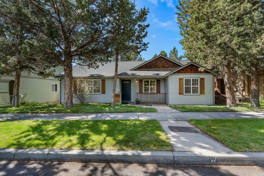 Charming single-level home in SE Bend's Foxborough neighborhood—ideal as a starter, downsize, or investment property. Light and bright with vaulted ceilings and newer LVP flooring for a spacious, airy feel. This 3 bed/2 bath, 1,402 sq ft home features an open great room with gas fireplace, roomy dining area, and kitchen with granite island. The fully fenced backyard offers plenty of space for your personal touch. Enjoy great curb appeal, beautiful tree-lined streets, and an alley-loaded oversized 2-car garage. Close to parks, schools, shopping, and main roads.