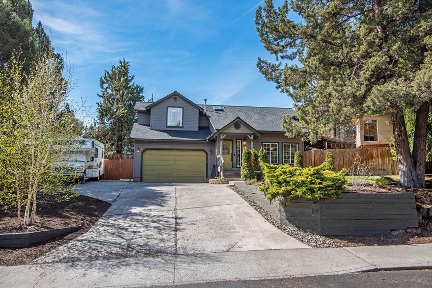 Nestled in the charming neighborhood Tanglewood on a quiet cul-de-sac, minutes from the Old Mill, downtown Bend, right next to Larkspur Park, new Community Center, and trails!  This well maintained, two story home has an inviting, bright interior with vaulted ceilings, hardwood floors arched doorways and skylights. The spacious kitchen has SS appliances, adjoins the dining area, and a glass door leading to the covered patio.  The primary bedroom boasts his and hers closets, new premium vinyl floors, ceiling fan, window alcove and a charming bathroom with same new flooring, sink and vanity. Upstairs bathroom has new, premium vinyl flooring, new sink, vanity, and toilet. The beautiful fenced yard has several flowering, mature trees, dog run, tree house for the kids and coveted RV parking.  Roof, skylights & furnace replaced in 2020, wired for back-up generator.