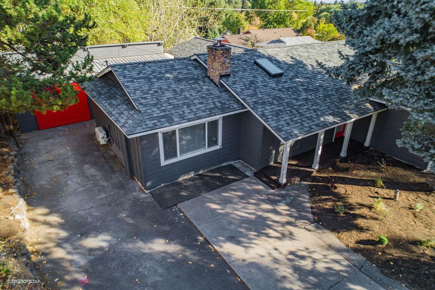 Updated mid-town home ready to move in.  Hardwood floors and new carpet.  All appliances are less than 3 years old.  Over 700 sq ft shop in the back.    Island with butcher block top.  2 ductless heat pumps installed.  Timbertech deck outside french doors.