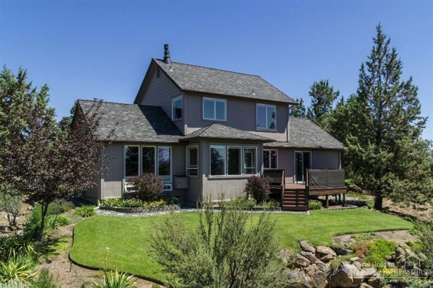 Truly delightful mini-estate in Whispering Pines. Pride of ownership abounds this fantastic property. Privately nestled on over 2.5 acres, this home has great Cascade Mountain views, a wonderful floor plan, stunning manicured outdoor areas & so much more! Master on the main opens to a spacious new composite deck. 2 beds & a bath up. Oversized garage. Recent improvements include new 40 year roof, new water heater & resealed driveway. Enjoy all the views across the open sky!