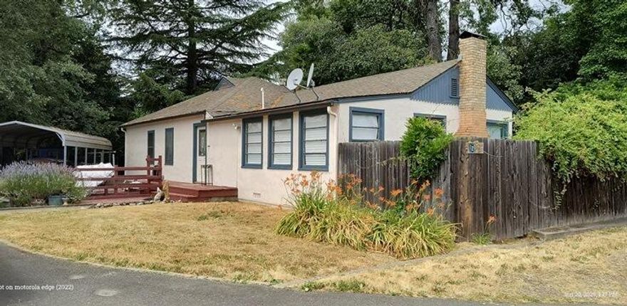 Step into this delightful 4-bedroom, 2-bath home filled with vintage charm and modern versatility. Enjoy cozy evenings by the classic wood-burning fireplace or make the most of the finished basement with exterior access—perfect for guests, hobbies, or extra storage. The spacious 0.47-acre lot features mature shade trees and multiple sheds, offering both beauty and function. Ideally located near shopping, dining, and scenic Baker Park on the Rogue River. Zoned R2, with exciting potential for a detached second dwelling. A rare chance to own a timeless Grants Pass treasure with endless possibilities!