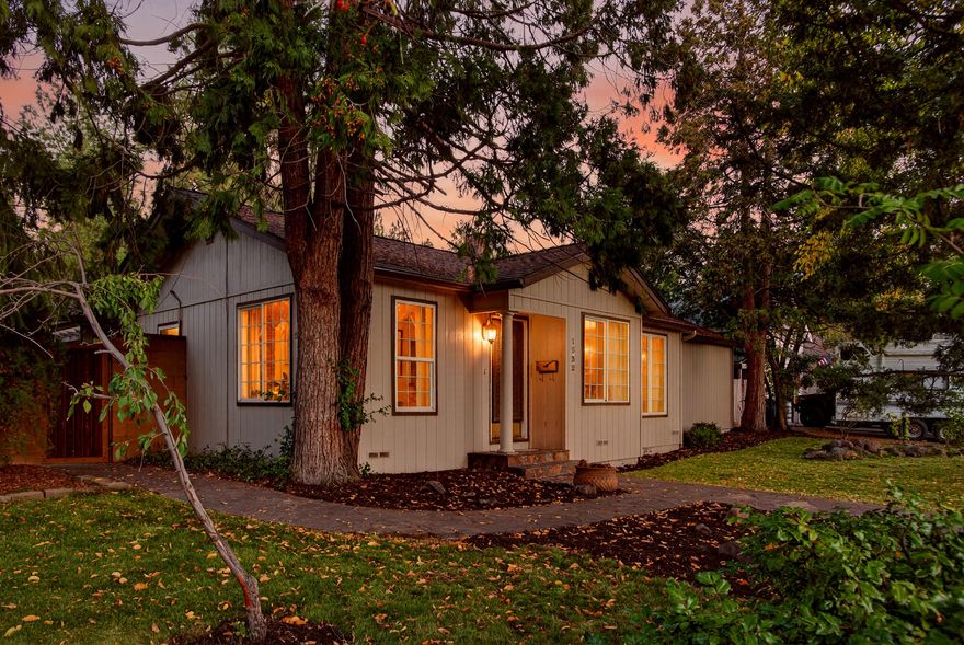 Prime Midtown location! Remodeled, updated and private, this is the retreat you have been looking for. Not only is this a large ¼ acre corner lot, but there is also a 6-car garage with a driveway long enough to fit an RV. Forfeit the electric bill with the 19 owned solar panels! 
There is a beautiful block wall surrounding the yard with custom gates to access the spacious courtyard ready for your personal touches. Living space feels larger in this L shaped single level home featuring a huge great room with built-in bookshelves, vaulted ceilings & travertine stone gas fireplace. The kitchen is a chef's delight along with soft close drawers/cabinets, refrigerator and dishwasher being less than a year old along with an abundance of storage. Water heater is tankless and the washer/dryer is less than 2 years old. The wood floors were refinished in 2021, there are so many unique qualities to this lovingly cared for home you really need to see it for yourself while you have the chance to.