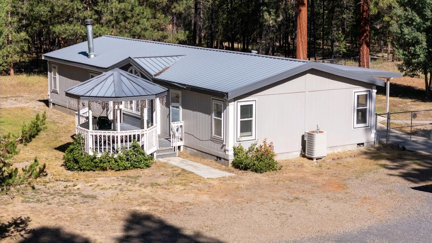 Nestled on 3.65 partially fenced acres,  inviting home offers everyday comfort with the added bonus of a gazebo for outdoor gatherings & a sprawling shop for your projects & storage.  Comfortable home features stainless SS appliances, center Island & ample cupboards.  Throughout main living areas are easy-care laminate flooring & carpet in bedrooms.  Generously sized primary bed with Walk in closet. abundant light in this spacious home  along with a gas fireplace in family room.  Covered back patio-ideal for enjoying the beautiful La Pine days&nights.  22x20 detached 2 car garage & 35x30 shop with electric & plumbing, sturdy Workbench &  addition 11x30 enclosed area.  Property offers a livable workspace, functional outbuildings & untapped potential.  Whether you are a1st time home buyer, a seasoned renovator searching for your next project or simply someone who dreams of a peaceful, expansive property, this home is ready to welcome you. With a little love it truly is gem in the making