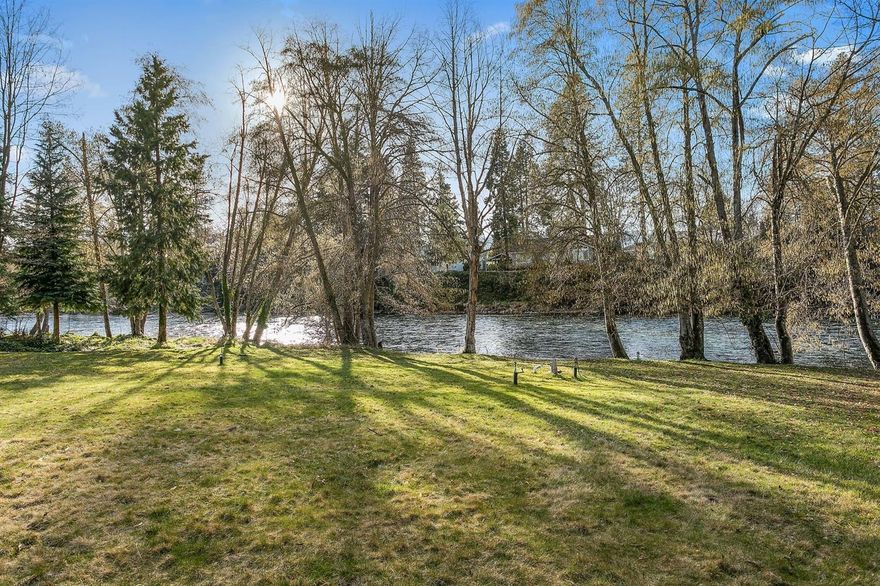 You will love the peaceful and magical setting for this lovely river front home. 1.39 acres of expansive lawn areas, framed by evergreens leads to the majestic Rogue River. The Oregon dream doesn't get any better than this. Covered porch for relaxing and watching the river flow or the evening stars. This 4 bedroom, solid, single level and one owner home was built in 1987 and very well maintained. The open floor plan makes this a great choice with spacious main living areas and split floor plan with master bedroom well separated from the 3 additional bedrooms and bath. Huge 902 square foot garage and storage room. Security gate. Lots of room to garden, entertain and FISH! Private setting. Brand new HVAC system. River rights for both irrigation and household use.
