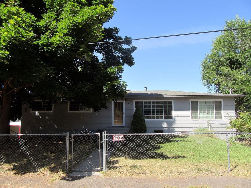Very nice updated 3 bedroom 1 bath home with office or could be modified for 4th bedroom, plus living room and large family room. New gas furnace, New carpet. Laminate and tile floors, vinyl windows, new exterior paint. Oak kitchen with appliances. Full basement with garage, utility room and tons of storage and more could be finished for additional living space. All on .28 acres with a 23x27 shop and fruit trees.