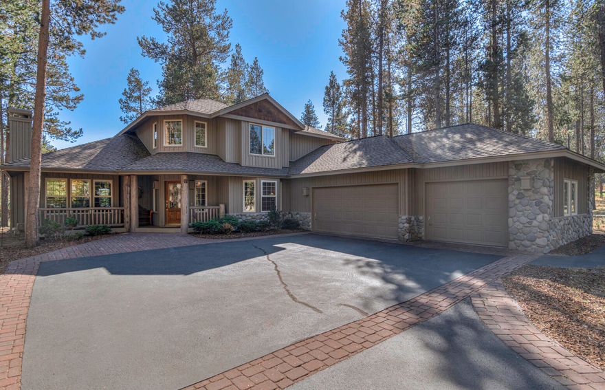 This Charming Lodge-style home has character from the moment you drive up.  Lots of natural light pours in the large windows.  The vaulted primary suite and the fifth bedroom are on the main level.  Upstairs includes a Junior Suite, two more bedrooms. Two bathrooms up. Spacious Deck with morning sun and gas hook up for bbq.  LARGE three-car garage.  Only 8 homes on this lane across from the Woodlands Golf Course.    Landscaping has drip system front and back.  Never rented.  One owner. Ask your Realtor for a copy of walk-through video on youtube.