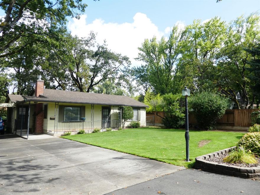 Well maintained single level cottage style home located at the top end of E. Main St. in desirable older East Medford. Light & bright with formal dining & spacious living room with brick fireplace including gas log insert and wood mantle. Tub/shower in the bath with tiled surround, wide hallway, electric forced air with central A/C (serviced annually) & some storm windows. Private backyard with mature landscaping, majestic Oaks, large patio and detached utility/garden shed. Loaded with potential & location, location, location!!