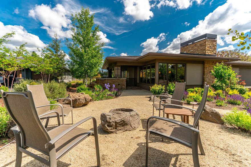 Right in the heart of the Tetherow Resort community, this rare single level gem has everything you could want! This 2,961 square foot prairie style home is an outdoor lover's dream with four unique outdoor living spaces for enjoying Central Oregon's 300+ days of sunshine. Wake up and enjoy your coffee on the covered front porch alcove, have lunch on the backyard patio while watching friends play golf, enjoy dinner at your outdoor kitchen followed by drinks and dessert around the fire stone while you watch Mt. Bachelor and all the stars above in this dark sky community. When it is time to retire, you are met by a beautifully designed, open concept home which boasts upgrades which include hickory hardwood floors, chef's kitchen with granite countertops, hidden coffee bar in the butler pantry, built-in dining room buffet with outlets for warmers/hot trays, radiant heating in the primary bathroom, three car tandem garage with epoxy flooring and work space, smart lighting and more.