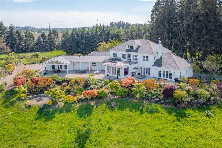 Rare Riverfront Property - Welcome to River Cove Farm! Nestled in the heart of Willamette Valley wine country & just minutes from downtown Salem, this one-of-a-kind estate offers a rare blend of lush acreage, Willamette River frontage, & breathtaking views. A gated entry opens to a long, paved driveway leading to this gorgeous Georgian-style home, which exudes elegance throughout. Spanning 19.05 acres, the property also has a cottage, barn, pastures, fruit trees, private beach & cove!  The main level primary suite features a cozy fireplace and ensuite bathroom, ensuring comfort and luxury. A library with built-ins and a majestic living room provide stunning views. The elegant kitchen and formal dining room are perfect for hosting memorable gatherings. The expansive game/recreation room includes a kitchenette and full bathroom, ideal for entertaining guests.  Enjoy the tranquility of the Willamette River frontage, complete with a private beach and a cove for boat tie-up.