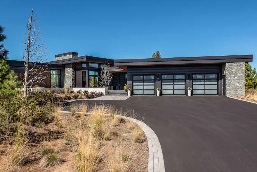 Located in Tetherow, one of Bend's most desirable golf communities, on the way to Mt Bachelor. Incredible High Timber custom home backs to National Forest and offers beauty and privacy that is unmatched and cannot be found anywhere else. Every finish and detail was carefully chosen and the results make this home irreplaceable. Single level living at it's best with floor to ceiling windows and views from every room. The great room has a stunning fireplace feature wall with views that take your breath away as you look out towards your private 25 yard lap pool, hot tub and surrounding forest. This well thought out kitchen is a chef's dream with gorgeous finishes and a very functional layout. The large master retreat is a true oasis. Two full guest suites and an office with patio access. The indoor living area leads seamlessly to the back patio with built in BBQ and outdoor kitchen. An oversized 3 car garage with self contained 4th bay can be for gear storage, a work out room or studio.