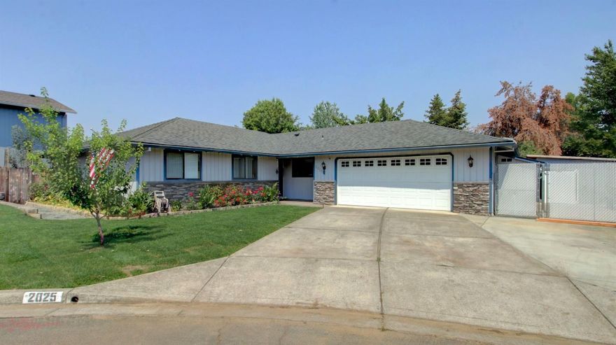 Quiet cul-de-sac location with well-designed Open Concept floor plan. New Trane HVAC system, carpet in living and bedrooms, all new landscaping and irrigation and newer 40-year comp roof. Property sits on a spacious .22 acre lot with large Paved RV Parking. Kitchen offers eat-in bar, granite, slate tile backsplash, cabinet pantry, and stainless-steel appliances including new dishwasher and refrigerator. Oversized living room with coffered ceiling detail, wood burning fireplace with brick surround. Master suite features walk in closet, master bath with skylight and private shower/lavatory. Custom tile showers and granite countertops in both baths. Slider provides access to the new deck and hot tub shaded by a Pergola draped by 4 grape varieties. Backyard is your own private oasis with raised garden beds, 20+ fruit trees, garden shed, and a detached 12x12 room the sellers call The Cabin''. Oversized finished 2 car garage with work bench and 220 plug in.