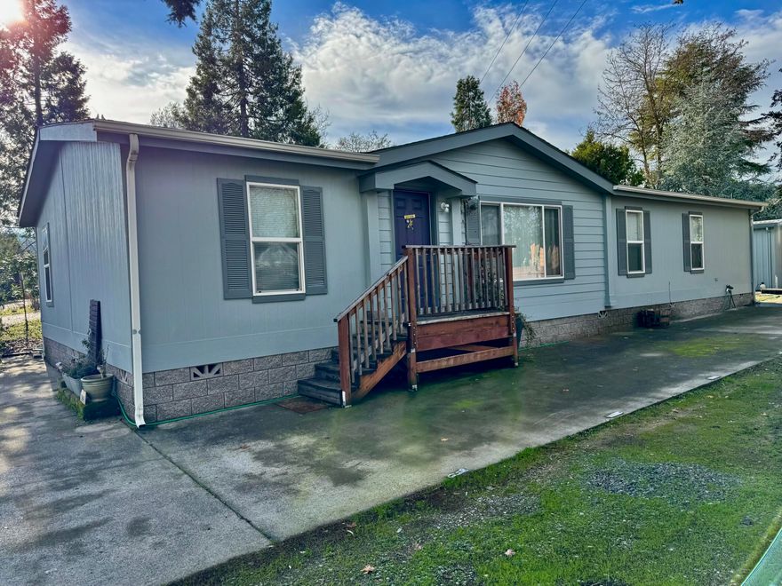 Beautiful meticulously maintained modular home with gorgeous kitchen/dining areas, great room, vaulted ceilings, enormous primary suite featuring separate office and big bathroom featuring garden tub and separate shower, two guest bedrooms; separate laundry room.   Lots of new flooring, an abundance of hardwood cabinets, vaulted ceilings, vinyl dual pane windows, full concrete block perimeter foundation, and vertical cement composition siding.
Included with the rented lot are huge concrete parking areas , plus steel RV cover,  plenty of room for garden and landscaping, and a nice detached shop/storage building with electricity and lights.  One of the nicest mfg home packages around!  55+