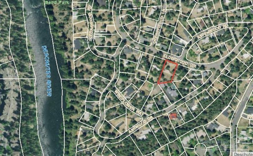 Build your dream home on this .42 acre lot located near the Deschutes River and Trail in desirable Woodriver Village! Perfect for anyone wanting to walk out their door to fish, float, paddle, or hike the trail. Less than one mile to restaurants & shops in the Old Mill and concerts at the Les Schwab Amphitheater. This unique neighborhood has mature pines, beautiful rock outcroppings and a campground feel. The 1974 manufactured home has no value and cannot be financed due to age. Buyer to do due diligence regarding partitioning. No HOA! Don't miss this amazing opportunity!