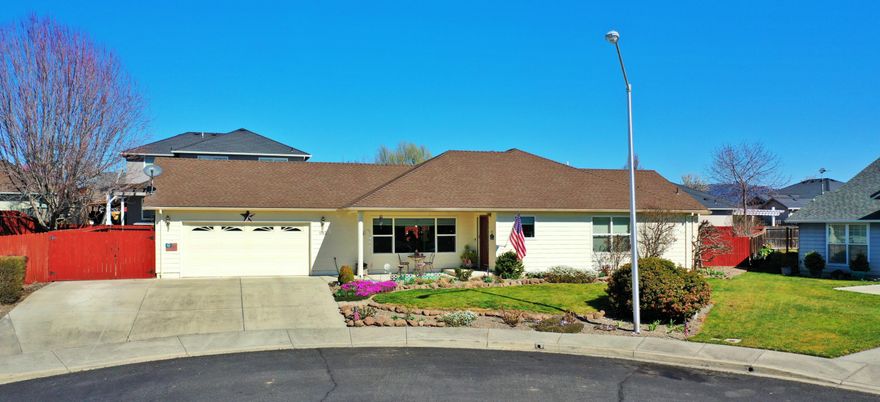 Here is a well maintained 3 bedroom, 2 bathroom, 1796 sq/ft home. This home offers a 40' RV parking area with 30 amp hook up & sewer dump, covered front and back patio areas to enjoy the outdoors, 12' vaulted living room ceiling, stainless steel appliances, including a 5 burner gas range, wine refrigerator, granite kitchen counters, touch kitchen faucet, custom blinds thru-out, coffered master bedroom ceiling, open floor plan, low maintenance back yard with drip system and front sprinklers for the grass with timer. The  spacious garage has a work shop area, house exterior painted in 2021 and a 6 x 8 metal storage shed, There is a raised garden bed, two blue berry bushes, an outdoor fire pit and a hot tub for relaxing. Schedule your showing today before this one is gone.