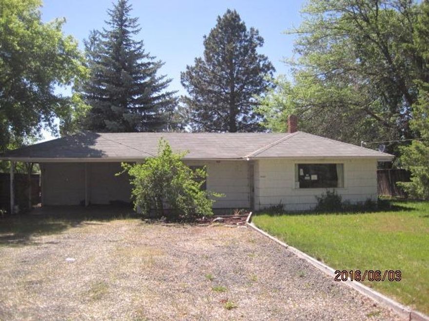 Great investment property or first home buy, on just shy of a half acre lot in the suburbs. This 2 bedroom, 2 bathroom home could use a little updating and some fresh paint, but features original charm. Nice fenced back yard with additional storage sheds and covered patio, with large mature trees for privacy.