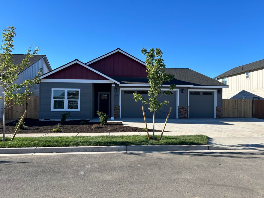 Welcome to Korbin Meadows, Phase 2, a new community in desirable neighborhood of SW Redmond. Lot 26 features the Summit floorplan w/ 2,284 sf of single-level living; 3 bdrms + den, 2 1/2 baths and 3 car garage. Vaulted primary bdrm features a lrg walk-in closet, dual vanity, shower w/ enclosed toilet. Great separation from two guest bedrooms sharing a full bathroom with tub/shower combo. Entertain in your kitchen w/ SS appliances, pantry, tiled backsplash, soft-close cabinets, extensive slab quartz countertops opening to vaulted dining area and great room w/ decorative gas burning fireplace. A utility/laundry room too! Durable laminate plank flooring thru-out & carpeted bdrms. Covered back patio, fenced yard & landscaping w/ sprinklers, RV/boat parking & entrance gate. Upgraded finishes & A/C included! Estimated completion July 2024.*Floorplan & rendering subject to change. Photos of home w/ similar floorplan. Interior finishes vary.