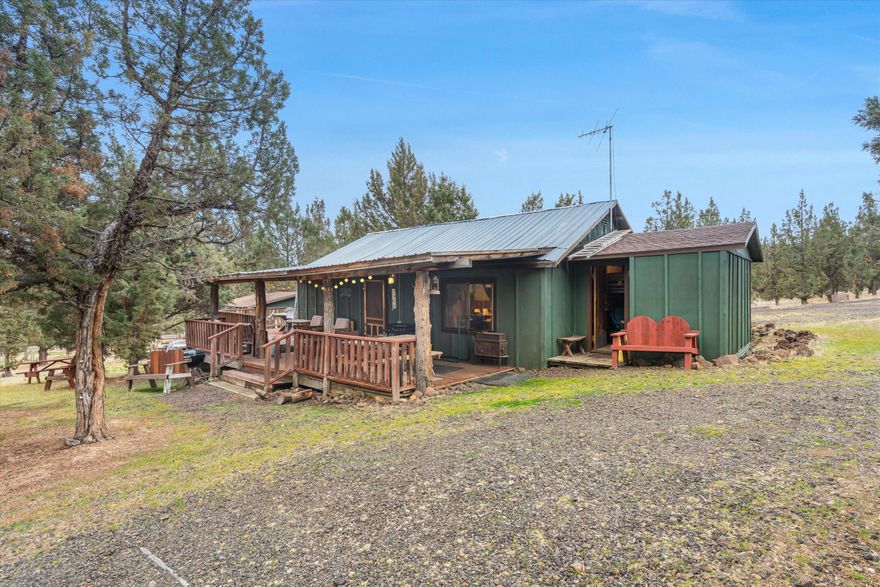 Amazing, Quiet 1.86 Acre Property with Views. Livable Cabin with 2 Bunkhouses, Gazebo with fireplace & Garage/shop. Additional sheds. 1000 gallon concrete septic tank in place with shared well. Nice Views, RV Parking Ready for an updated home or manufactured. County says 3 Bedroom, Cabin is 1 Bedroom plus 2 bunkhouses. Possible Seller Carry with 30% Down Payment. Must See!
