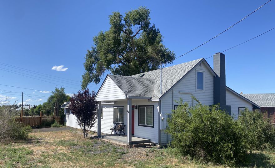 Rare acreage just outside the city limits of Bend, Oregon. Feel the peace of rural life yet still just 13 minutes to Downtown, the Deschutes River and the Hayden Homes Amphitheater. This move in ready darling 40's farmhouse sits on 1.15 acres of EFU land and has low property taxes and water bills. Enjoy epic sunrises and sunsets with fantastic Cascade Mountain Views. Fully fenced large garden area. Room for trucks/toys/trailers. No HOA. Large separate living space with outdoor entrance has a full bath. Perfect for generational living! Two bedrooms upstairs as well as sitting nook with skylight.  Another bedroom and bonus room on main. Hardwood floors in living, dining and kitchen, LVP in the rest of the house. 3 mini split units were recently added for comfort year round. The wood burning fireplace keeps the home warm and costs down in the winter. Older barn is great for storage, garage. Street traffic is mostly commuters. The rest of the time it is very quiet.