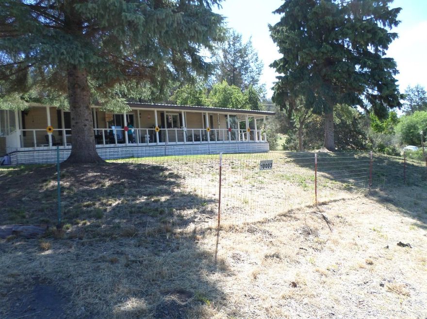 Large 2 bedroom 2 bath MFH on 1.74 acre. Asphalt Driveway, 2 car detached garage. Enclosed porch with a greenhouse feature. Nie front yard with a long front porch 10x50. Front yard is fenced. A new Gas Heater recently put in, Vinyl Windows, wood shed. Nice Home, come see. Seller will go Cash Only, As IS.