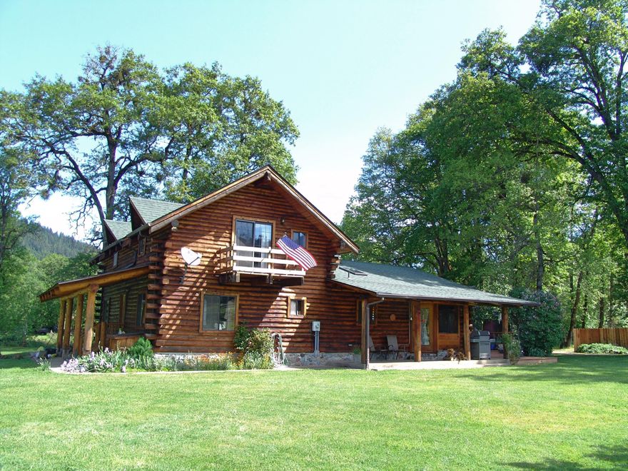 Are you looking for your Oregon Dream Home? Look no further! Found: a gorgeous custom-crafted log home on 5 level acres of mostly pasture, surrounded by incredible mountain views. The home is 3 bd/3 bath and an office with a vaulted ceiling in the Great Room and a basement. Custom made real creek-rock hearth features a Regency woodstove on the living room side and a wood cookstove on the kitchen side. There is a generator, propane lights and range/oven for back-up power. The Master Bedroom features a slider to a private deck, walk-in closet and clawfoot tub in the bathroom. Outside, you'll enjoy views of the mountains, lawn and rock flower beds from the wrap-around deck. You're all set for your animals with a barn w/a loft, water & electric, chicken coop w/12 nesting boxes and an additional shed & pen. There is a 32'x 12' wood & equipment shed and RV barn. And don't forget the fenced garden area and multiple fruit trees: pear, cherry, walnut, plum & apple!