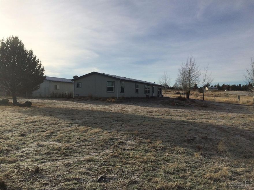 Manufactured home and shop on 4.87 acres.