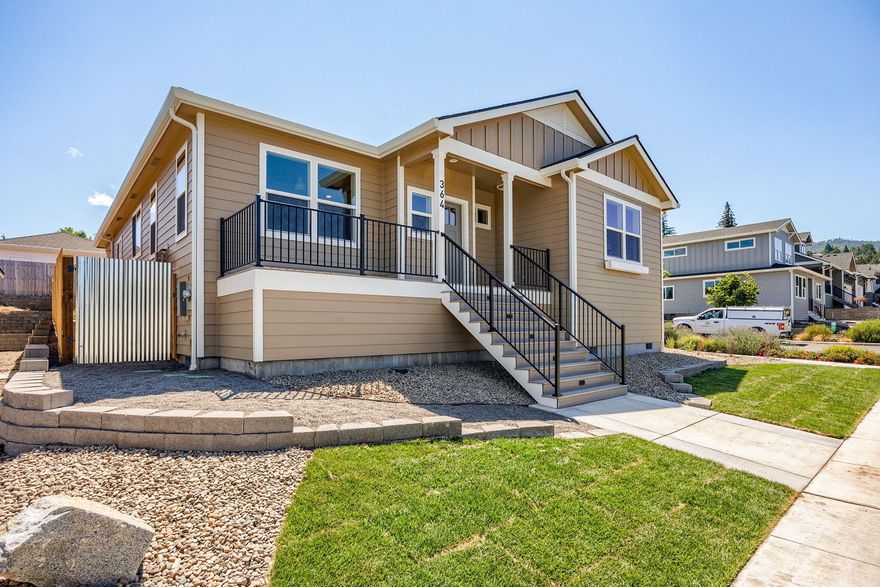 Don't miss this completed single level Taylored Elements Construction home, with great views on a premier corner lot in the West Village subdivision which is just .8 of a mile from downtown Ashland. It's built to Earth Advantage standards with green features and energy efficiency including solar panels, EV charger in the 2 car garage and ductless heating and cooling system. This 3 bedroom, 2 bathroom home has a gas fireplace in the living room, lots of windows for abundant natural light, raised and vaulted ceilings, engineered hardwood floors in main living areas, carpet in bedrooms, tile floors in bathroom and large laundry room, quartz countertops and custom cabinets with soft close drawers. The home has a front deck/porch with great views and back patio with a fully landscaped yard, drip irrigation and side to back yard 6 foot fencing. Make an appointment to view this low maintenance, comfortable home today!