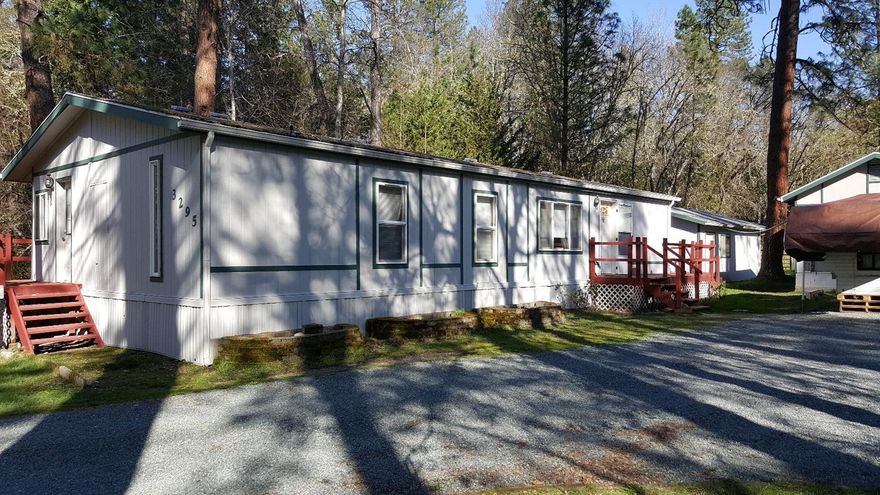 Located minutes to Grants Pass with the rural country feeling on a dead end street of Elk Lane. Walking distance to hiking/mountain and horseback riding. 3 bedroom 2 bath home with multiple outbuildings for storage and leisure. Mature trees yield shade in the summer months over the covered deck off the rear of the home. Small covered pen with fenced rear property for your pets and livestock to graze. Low Taxes! Located in District 7. All information deemed reliable, but not guaranteed.