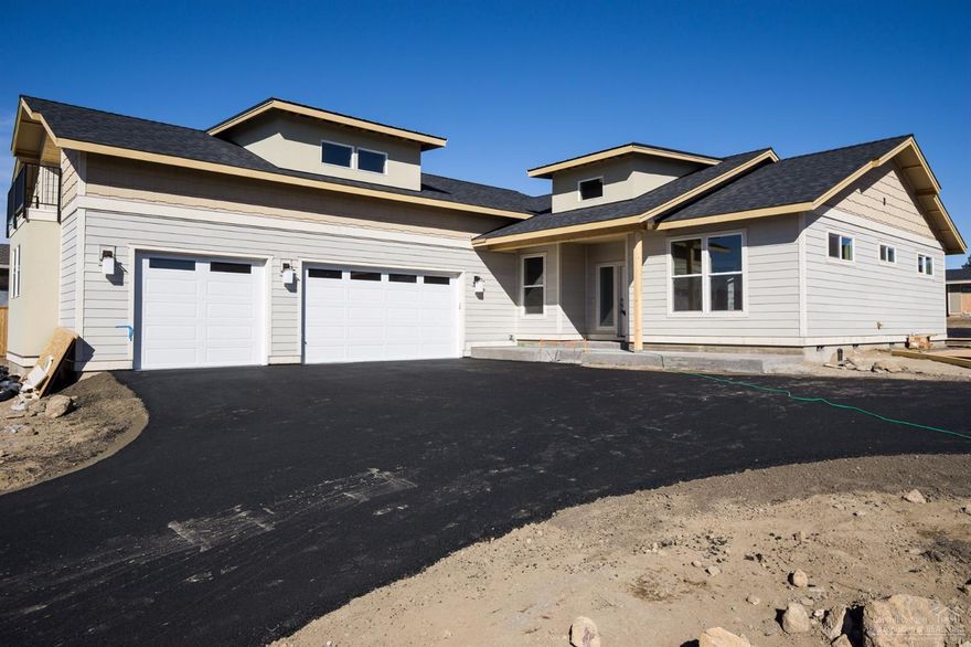 Designed for gracious living, this attractive home by JD Neel Construction Inc. places all rooms on the main level with the exception of a 432-sq ft bonus room and balcony over the three-car garage. The master suite and remaining bedrooms at opposite sides of the home are separated by a spacious great room with island kitchen. A den/office opens from the foyer. The master bath features dual vanity sinks and a large walk-in tile shower. Covered front porch and rear patio. Large lot with room for RV parking.