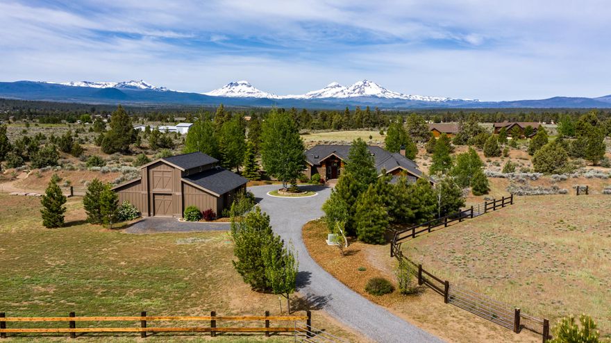Pride of ownership shines at every detail in this exquisite custom built home on nearly 25 acres  with stunning Cascade Mountain backdrop. Resting down the long, gated driveway, bookend by acres of ryegrass pasture, this single level home is a true work of art. The great room features a dry stacked stone fireplace & hand distressed Russian Alder wood floors flowing to a beautiful chef's kitchen. Slab granite counters, KitchenAid stainless appliances & oversized island make a great space to cook & entertain. The master suite; separated from the other bedrooms, offers a walk-in Byzantine marble & river pebble shower, sauna, soaking tub & access to hot tub on the private patio with exceptional Mt views. Extra deep, 3-car garage, pull-through driveway plus large barn complete with 4 horse stalls, 2-car garage, finished tack room, full bath & unfinished 14x36 loft above with paver patio. Plus, full RV hookups. High-end finishes throughout this estate, making it one to admire.