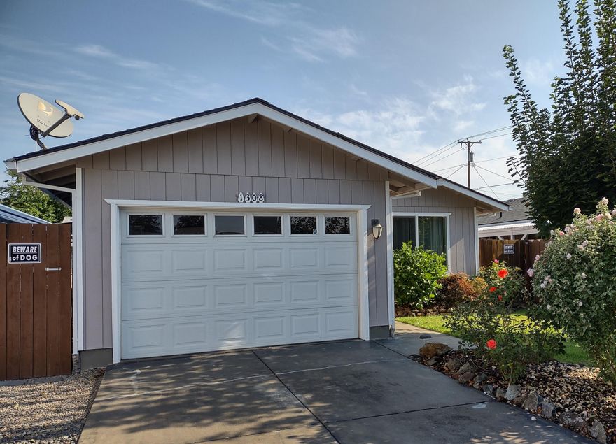 Clean and cute 1994, move in ready 3 bedroom, one bath, one car attached garage with lots of shelves, large shed with loft storage in fenced yard, covered RV or boat parking behind gate; auto sprinklers front and rear; economical wall air unit and individual heaters each room. Very nice kitchen with tile floor and counters; fan lights in most room; lovely wood laminate floor liv room and hall; carpeted bedrooms. Almost new Whirlpool DW; step saver laundry in attached garage off dining area; slider to yard; cute barn door touches in pantry and linen; apple and pear tree.