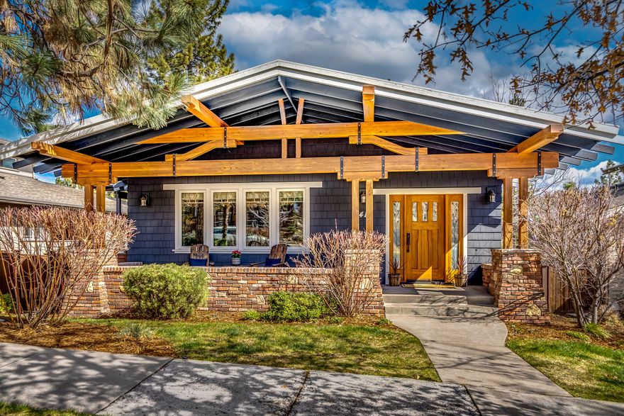 Beautiful 3 bed 2 bath home w/ office or 4th bedroom, located in the desirable neighborhood of Northwest Crossing! Located just one block from Lewis & Clark park, High Lakes Elementary, and a short stroll to restaurants, shops, several parks, Discovery lake and dog park. As you approach this lovely home, you will find a covered front porch with beautiful wood beams to greet you. Upon entering, you will immediately recognize the quality craftsmanship of the solid Brazilian cherrywood floors, 10ft beamed ceilings, large windows in the living room and solid wood doors throughout. Enjoy the chef's kitchen with recently updated backsplash, coffered ceilings, granite tiles, stainless steel appliances and pantry. Dining room opens to a covered patio and fenced yard.  This home features a soaking tub & walk-in closet in the spacious primary bedroom, two additional bedrooms and den. Tons of storage and large 2 1/2 car oversized garage! Exterior was painted fall of 2021, fence is newly stained.